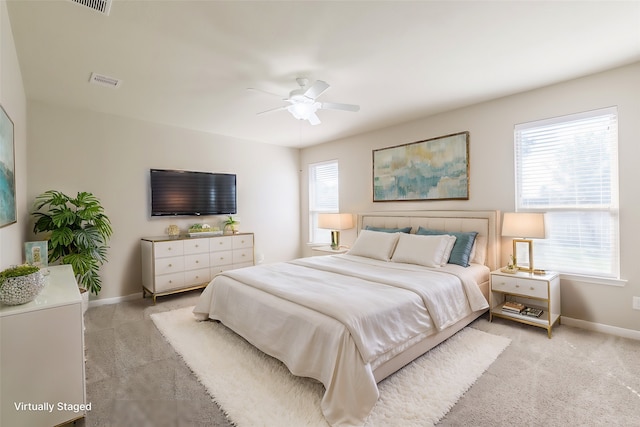 carpeted bedroom featuring ceiling fan