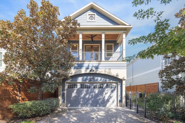 view of front facade with a garage and a balcony