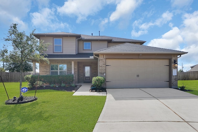 prairie-style home with a front lawn and a garage