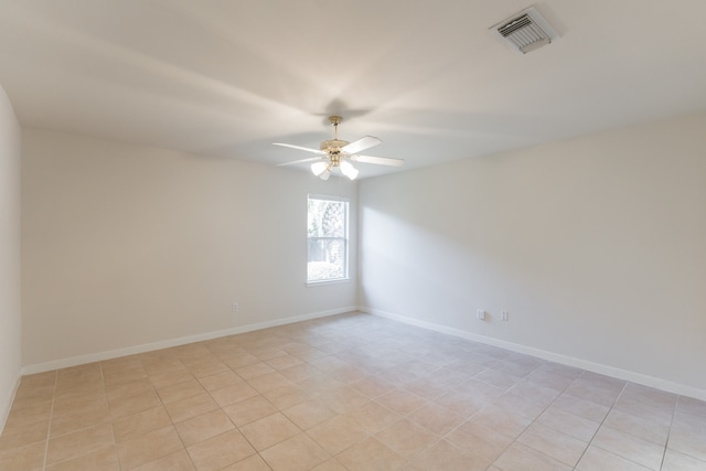 unfurnished room featuring ceiling fan and light tile patterned floors