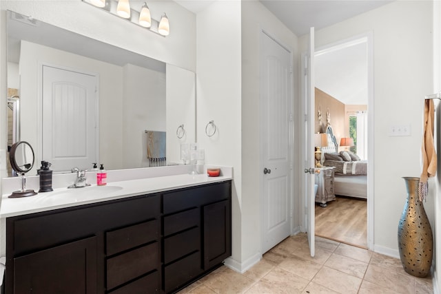 bathroom with vanity and wood-type flooring