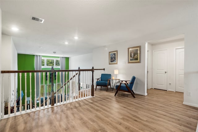 sitting room featuring light hardwood / wood-style floors