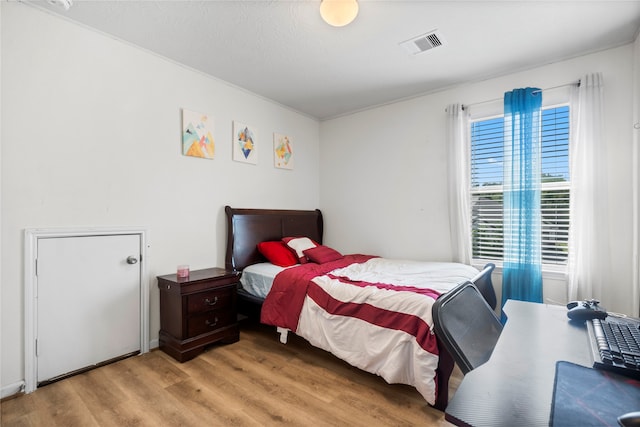 bedroom featuring light hardwood / wood-style flooring