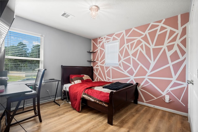 bedroom featuring hardwood / wood-style floors