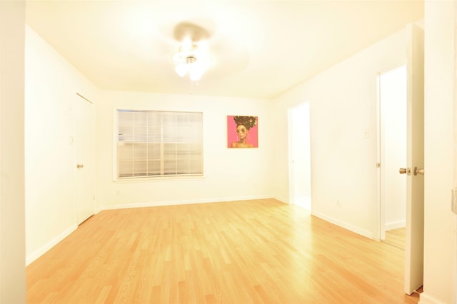 spare room with ceiling fan and light hardwood / wood-style flooring