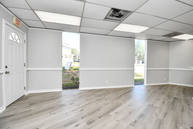 entryway featuring a drop ceiling and light wood-type flooring