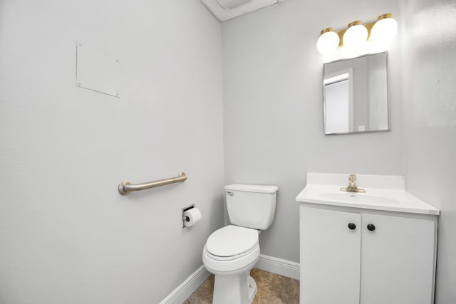 bathroom featuring vanity, toilet, and tile patterned floors