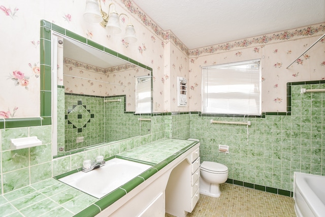 full bathroom featuring vanity, toilet, tile walls, and shower with separate bathtub