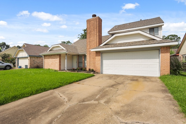 view of front of property with a front lawn and a garage