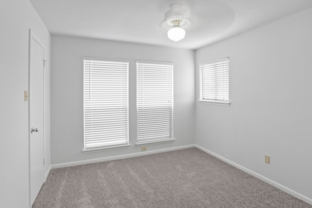 empty room with light carpet and ceiling fan