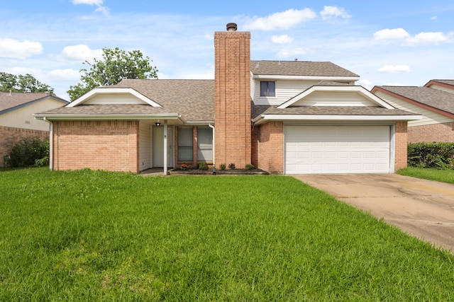 view of front of house with a front lawn and a garage