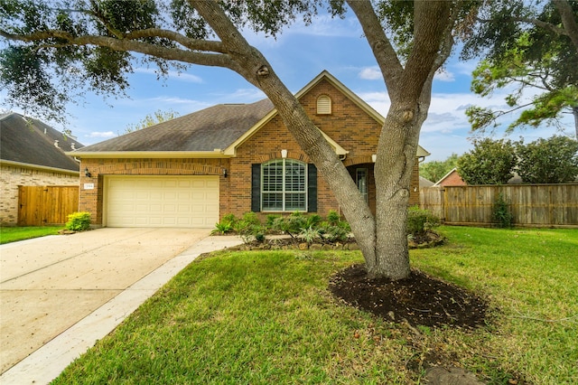 view of front facade with a garage and a front lawn