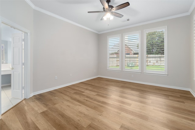 spare room with ceiling fan, ornamental molding, and light wood-type flooring