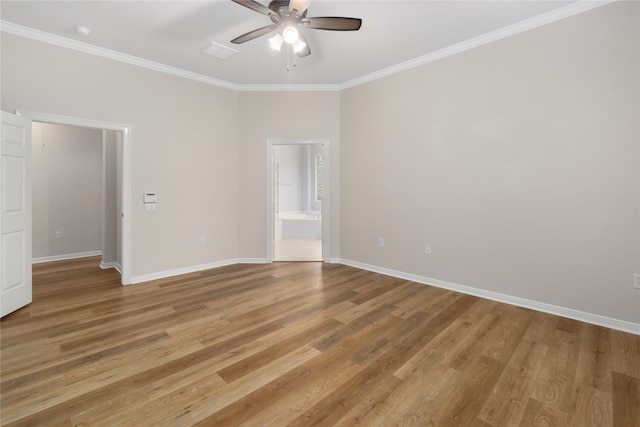 unfurnished room featuring light hardwood / wood-style flooring, ornamental molding, and ceiling fan