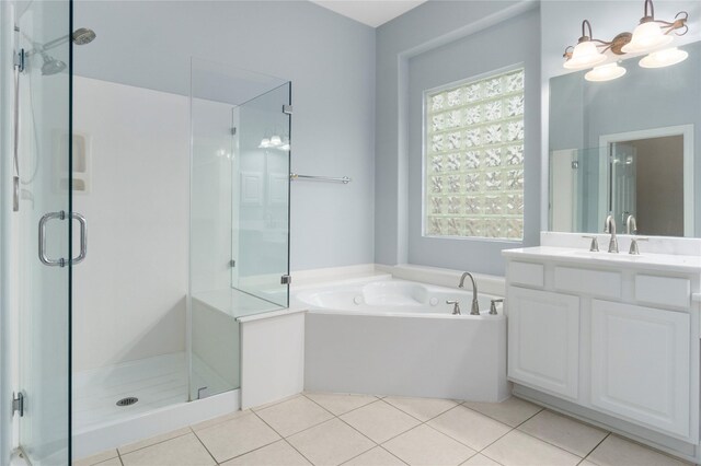 bathroom with vanity, shower with separate bathtub, and tile patterned flooring