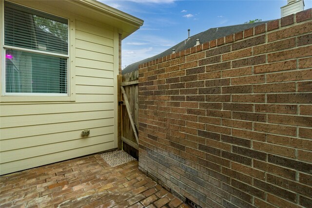 view of side of property featuring a patio area