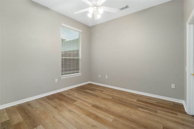 empty room featuring light hardwood / wood-style flooring and ceiling fan