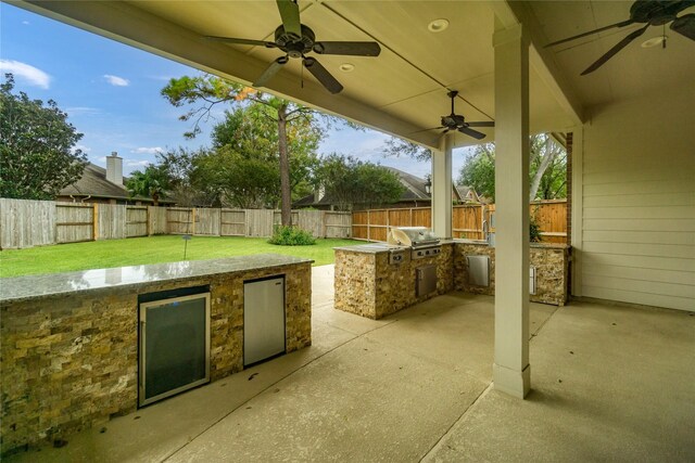 view of patio / terrace with grilling area, area for grilling, and ceiling fan