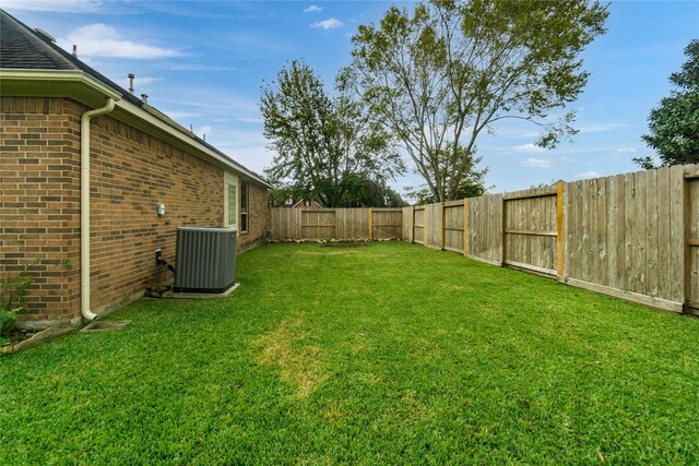 view of yard featuring central AC