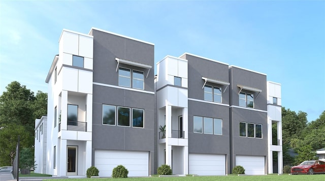 view of front of home featuring a balcony and a garage