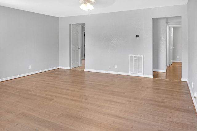 unfurnished room with ceiling fan and light hardwood / wood-style floors