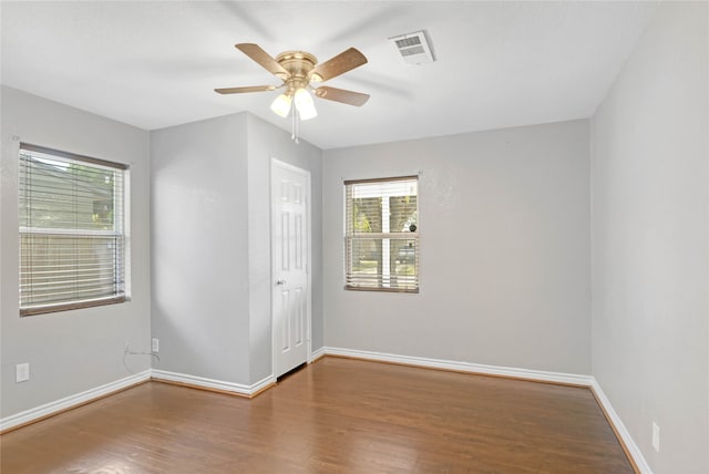 spare room featuring ceiling fan and wood-type flooring