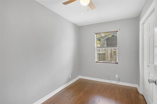 interior space with ceiling fan and dark hardwood / wood-style flooring