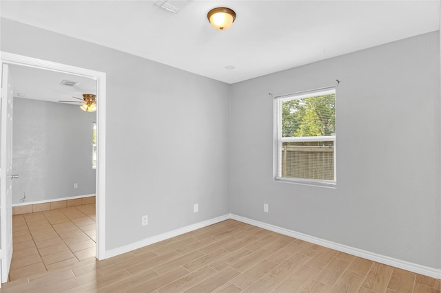 empty room featuring light hardwood / wood-style floors and ceiling fan