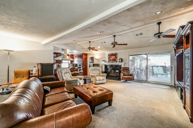 carpeted living room with a textured ceiling