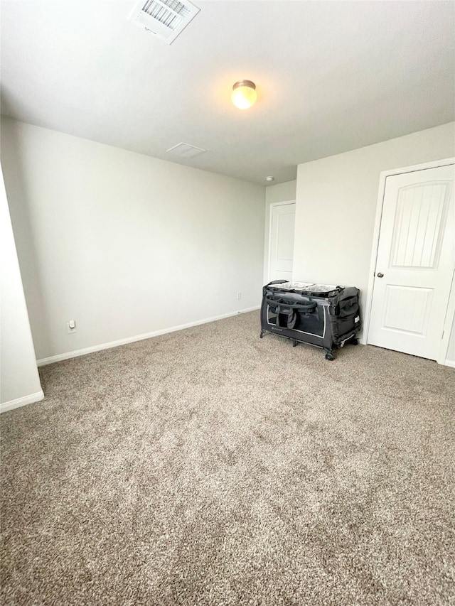 empty room with carpet flooring