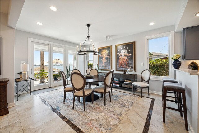 7109 Broadway St, Galveston, TX 77554 - dining space featuring an inviting chandelier, recessed lighting, baseboards, and a healthy amount of sunlight