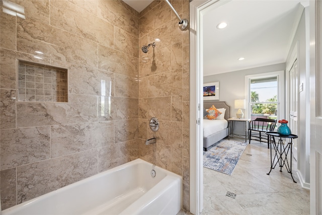 bathroom featuring ornamental molding and tiled shower / bath combo