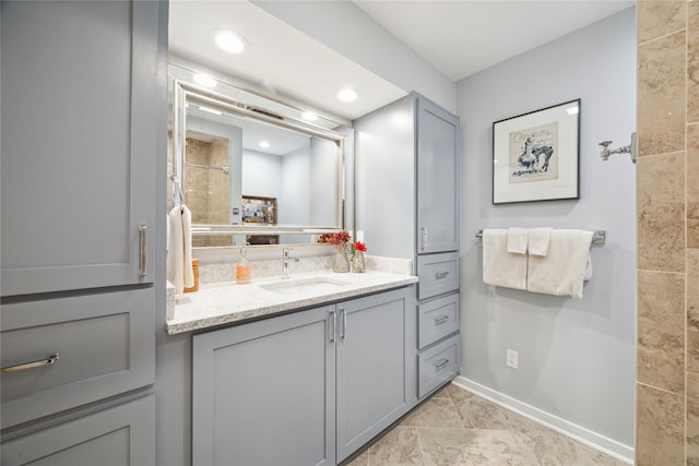 7109 Broadway St, Galveston, TX 77554 - full bathroom with vanity, baseboards, recessed lighting, and tiled shower
