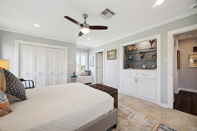 bedroom featuring a closet, ornamental molding, and ceiling fan