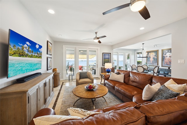 living room with light hardwood / wood-style floors and ceiling fan