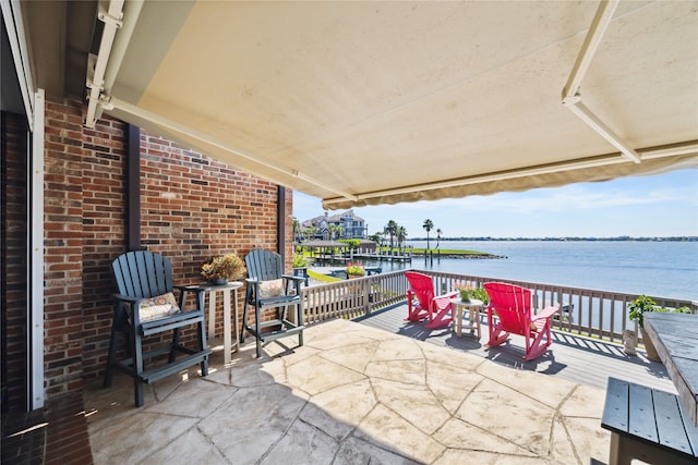 view of patio / terrace featuring a deck with water view