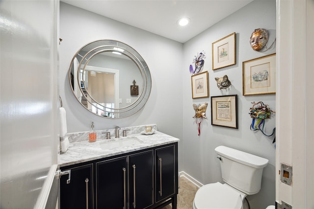 7109 Broadway St, Galveston, TX 77554 - half bathroom with vanity, recessed lighting, baseboards, and toilet