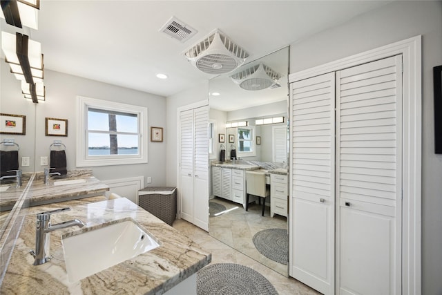7109 Broadway St, Galveston, TX 77554 - bathroom featuring vanity, a closet, recessed lighting, and visible vents