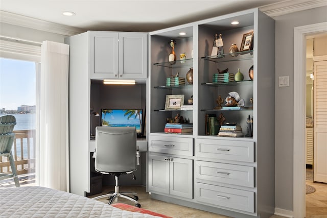 bedroom with ornamental molding and light tile patterned floors