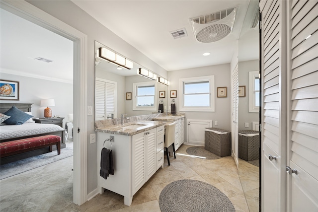 bathroom featuring vanity and ornamental molding