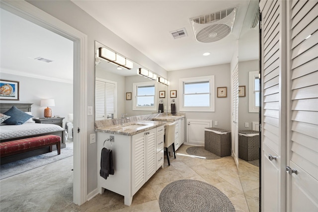 7109 Broadway St, Galveston, TX 77554 - bathroom with connected bathroom, baseboards, visible vents, and vanity