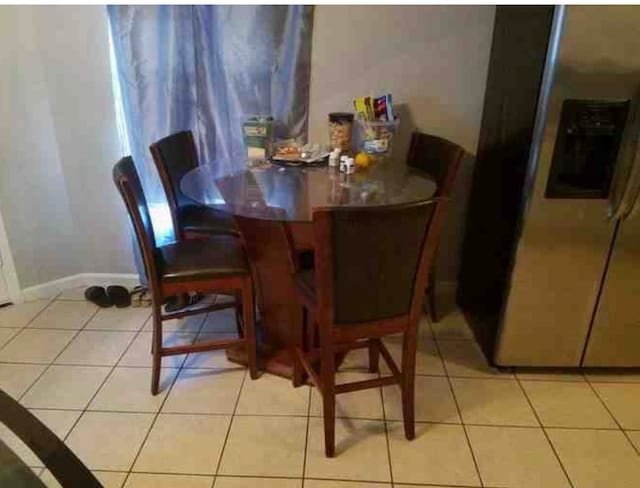 view of tiled dining space