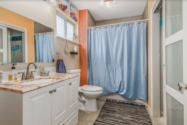 bathroom with tile patterned flooring, vanity, toilet, and a shower with curtain