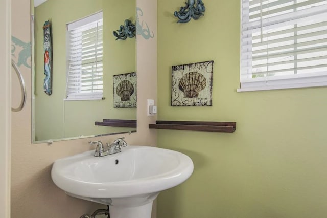 bathroom featuring sink and a wealth of natural light