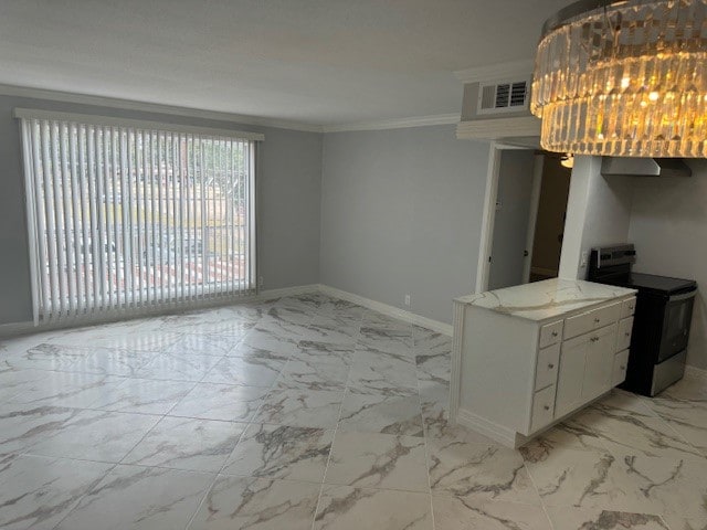 kitchen with ornamental molding, white cabinetry, light stone counters, and electric stove