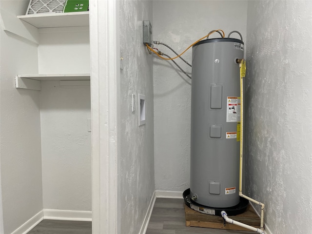 utility room featuring electric water heater