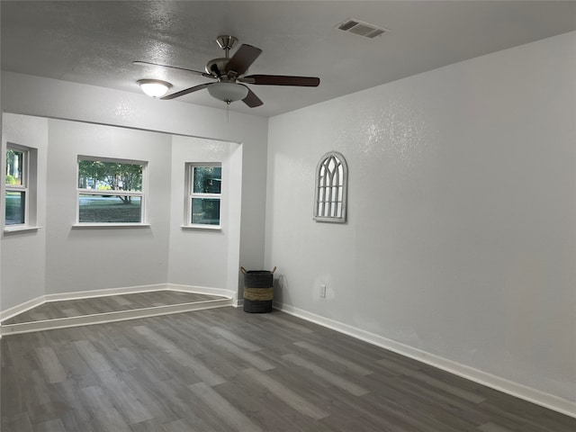 spare room with ceiling fan and hardwood / wood-style flooring