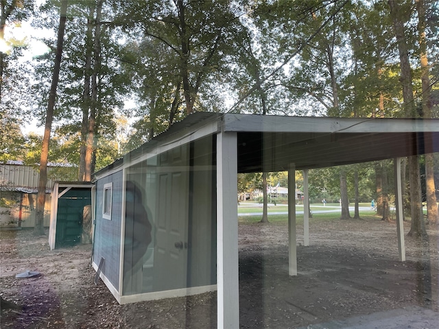 view of outbuilding featuring a carport