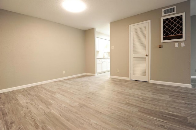 9700 Leawood Blvd Unit 2110, Houston, TX 77099 - empty room featuring light wood finished floors and baseboards