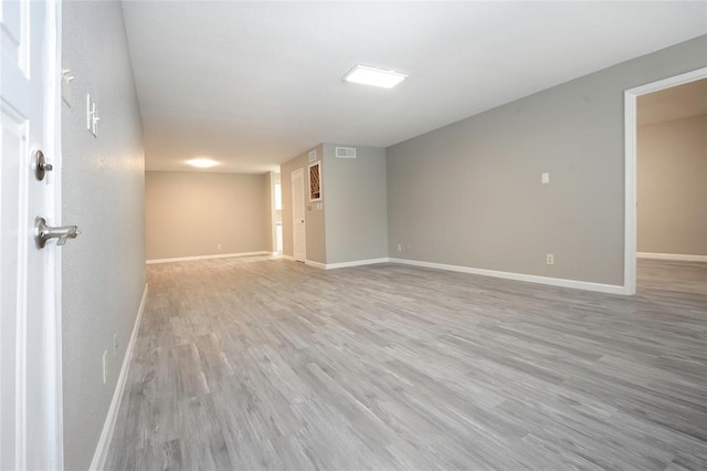 unfurnished room with light hardwood / wood-style flooring